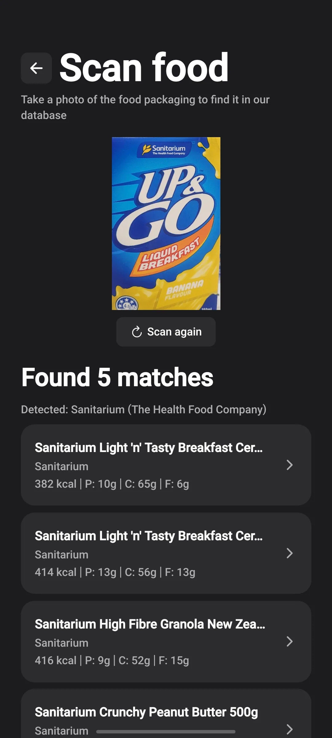 Scan food screen showing a packaging photo and five matching products with calories and macros.